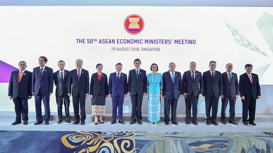Union Minister for Planning and Finance U Soe Win and Officials pose for a documentary photo at the 50th ASEAN Economic Ministers’ Meeting at Shangri-La Hotel in Singapore.